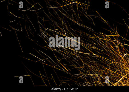 Dancing flames and sparks isolated on black Stock Photo - Alamy