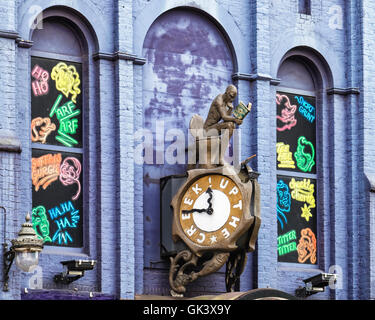 Greenwich, London. 'Up the Creek' comedy and cabaret club. Man sits on toilet reading Beamo comic. Quirky building detail. Stock Photo