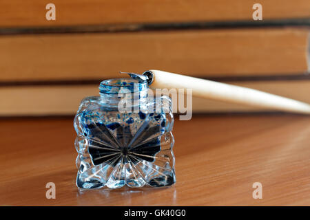 vintage fountain pen on the background of old books Stock Photo