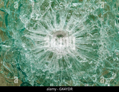 Bulletproof glass after the shooting with traces of bullets, test Stock Photo