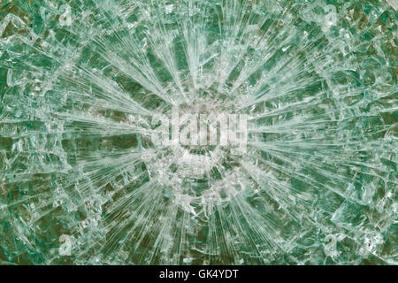 Bulletproof glass after the shooting with traces of bullets, test Stock Photo