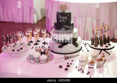 Stylish sweet candy bar set at the wedding ceremony Stock Photo