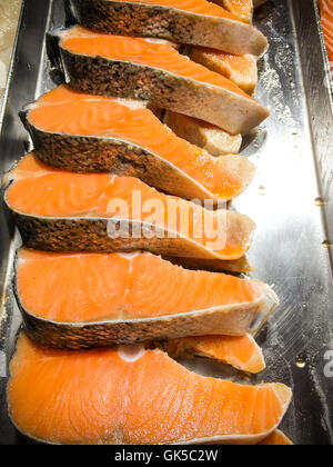 fresh salmon fish in supermarket, slide salmon fish on ice Stock Photo