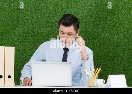 Grassland business men using laptop Stock Photo