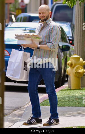 Jon Cryer is barely recognizable with a shaved head and beard on Mother's Day carrying baked goods from Joan's on Third  Featuring: Jon Cryer Where: Studio City, California, United States When: 08 May 2016 Stock Photo