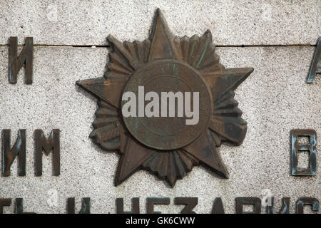 Order of the Patriotic War. Soviet military decoration depicted on the Soviet War Memorial at the City Cemetery in Jihlava in Vysocina Region, East Bohemia, Czech Republic. Stock Photo