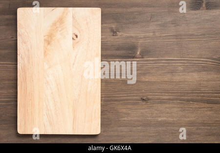 Empty rectangular board on a wooden background Stock Photo