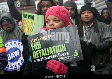 Chicago, Illinois - November 28, 2014: Striking Walmart workers and supporters protest outside a store on Black Friday. Stock Photo