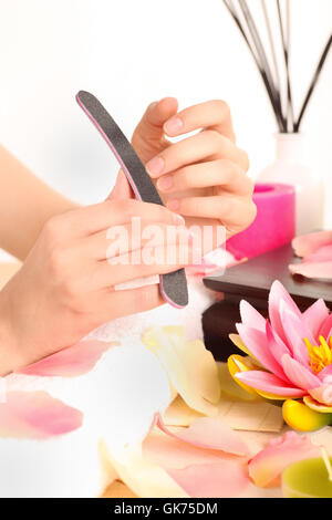 woman makes manicure Stock Photo