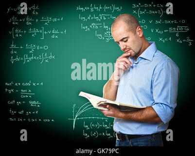 Teacher Read Math Math teacher reading book in classroom Stock Photo - Alamy