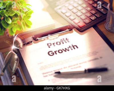 Profit Growth on Clipboard. Stock Photo