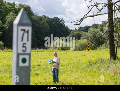 Walking trail keeper Horst Jaekel pictured in a field near a walking path in the Maerchenwald forest in the Muskauer Faltenbogen geopark near the small village of Pusack an der Neisse, Germany, 11 August 2016. To keep the routes in good condition, trail keepers check them regularly. PHOTO: PATRICK PLEUL/DPA Stock Photo