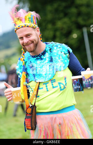 Green Man Festival, Wales, UK. 19th Aug, 2016. Time to get the beers in after the rain ceased. Far out fashion at Green Man. Over 25,000 music fans are due to attend over the weekend. Stock Photo