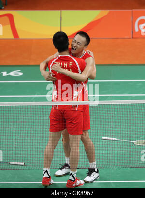 Malaysia's Tan Wee Kiong (behind) and Mak Hee chun return a shot to China's  Chai Biao and Zhang Nan (not in the picture) during their men's double  match at the Japan Super