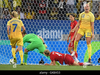 Rio de Janeiro, Brazil. 19th Aug, 2016. Stina Blackstenius of Sweden (R) celebrates after she scored the 1:2 for her team during the Women's soccer Gold Medal Match between Sweden and Germany during the Rio 2016 Olympic Games at the Maracana in Rio de Janeiro, Brazil, 19 August 2016. Other players L-R: Sweden's Lisa Dahlkvist, German goalkeeper Almuth Schult, Leonie Maier and Annike Krahn. Photo: Soeren Stache/dpa/Alamy Live News Stock Photo