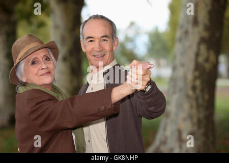 beige coat dancing Stock Photo