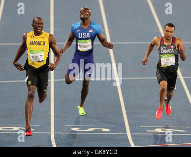 (left-right) Jamaica's Usain Bolt, USA's Lashawn Merritt and Canada's Andre De Grasse during the Men's 200 Metre final at Olympic Stadium on the thirteenth day of the Rio Olympic Games, Brazil. Stock Photo