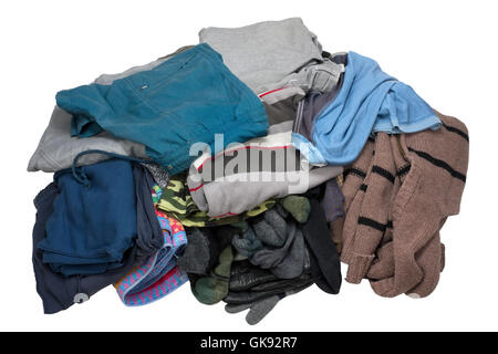Heap of the worn old but pure and washed men's top wear - sweaters, undershirts, shorts, trousers. isolated with patch Stock Photo