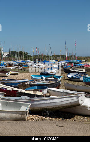 Small Boats on the shore in Orford Suffolk England Stock Photo