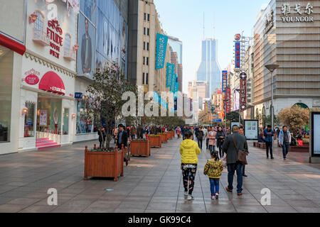 Shanghai, China - March 26, 2016: Tourists walking in Nanjing Road, one of the world's busiest shopping streets. Stock Photo