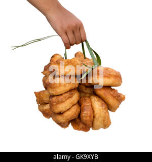Hand holding traditional fresh baked Moroccan donuts Stock Photo