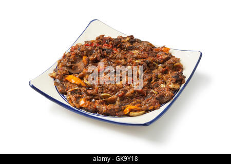 Moroccan fresh eggplant and bell pepper salad on white background Stock Photo