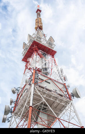 Telecommunication mast TV antennas wireless technology with blue sky in the morning Stock Photo