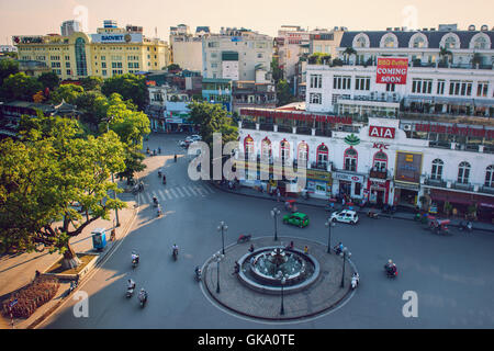 Hanoi,Vietnam - 09 May,2014: People go in the street in sunny afternoon day at Hoan Kiem lake Stock Photo