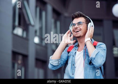 Joyful man listening to music Stock Photo