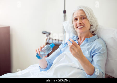 Senior woman being at hospital Stock Photo