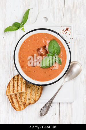 Cold gazpacho tomato soup in bowl with toasted bread Stock Photo