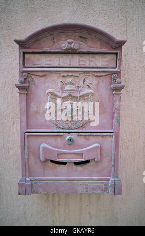 Old mailbox hanging on the wall Stock Photo