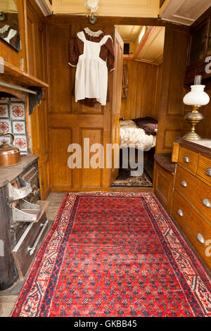 The interior of a vintage living wagon used by a traveling ploughman or road man pulled behind a steam roller Stock Photo