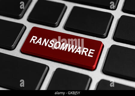 ransomware red button on keyboard, business concept Stock Photo