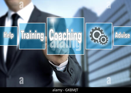 coaching touchscreen is operated by businessman. Stock Photo