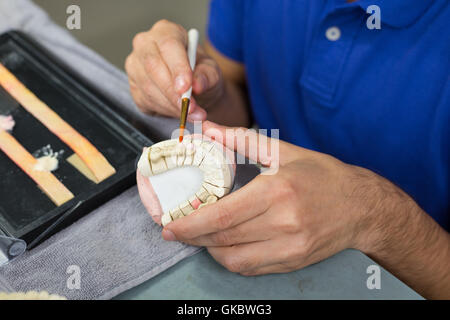dental technician in the dental laboratory Stock Photo