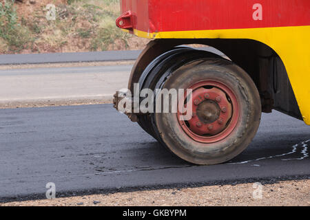 Pneumatic tyred roller compactor at asphalt road repairing Stock Photo