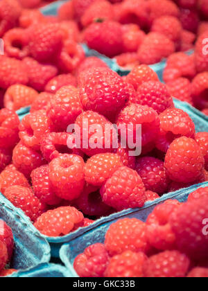 Punnets of fresh raspberries for sale at Granville Island Public Market in Vancouver, British Columbia, Canada. Stock Photo