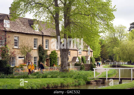 Riverside cotswold stone cottages  in spring, Lower Slaughter, Cotswolds,  Gloucestershire, UK Stock Photo