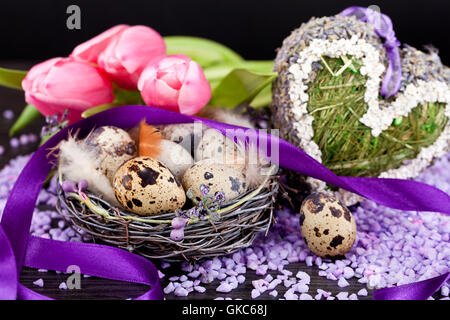 pink tulips with lavender and easter eggs Stock Photo