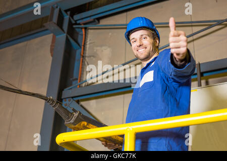 construction worker uses a machine Stock Photo