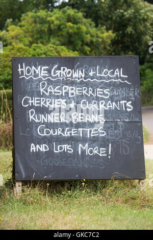 Home grown and local produce for sale chalk sign outside an english farm shop. Oxfordshire, UK Stock Photo