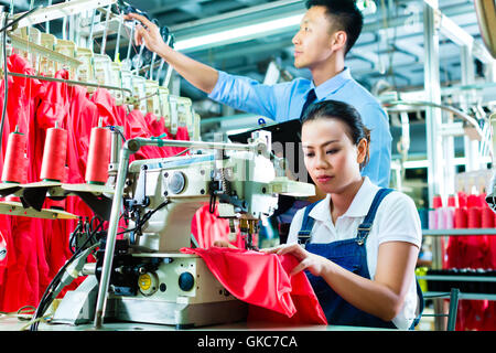 seamstress and shift supervisor in a textile factory Stock Photo