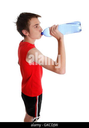 Teenage Boy Squirting Water Into His Mouth Stock Photo - Download Image Now  - Adolescence, Bottle, Drink - iStock