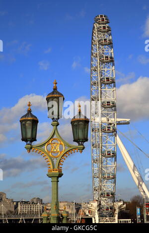 Detail of a lamp on Westminster Bridge with London Eye in the background, London, Great Britain Stock Photo