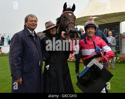 Rivet and Frankie Dettori with trainer William Haggas after winning the British Stallion Studs EBF Convivial Maiden Stakes during day three of the 2016 Yorkshire Ebor Festival at York Racecourse. Stock Photo