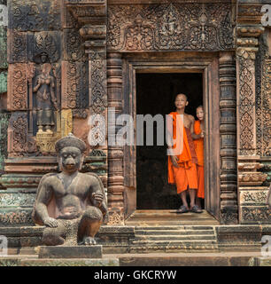 Two Buddhist Monks in Orange robes at Siem reap temple,Cambodia,Asia Stock Photo