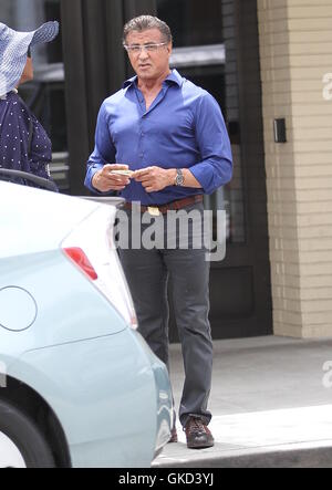 Sylvester Stallone stops to talk to a fan in Beverly Hills  Featuring: Sylvester Stallone Where: Los Angeles, California, United States When: 18 May 2016 Stock Photo