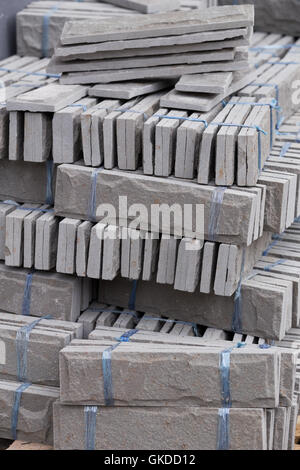 pile of gray stone tiles prepare for install with cement for house decoration Stock Photo