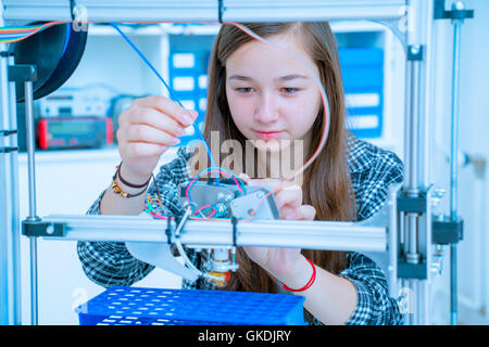 Female Architect Using 3D Printer Stock Photo